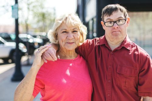 a guardian an a young man with Down Syndrome