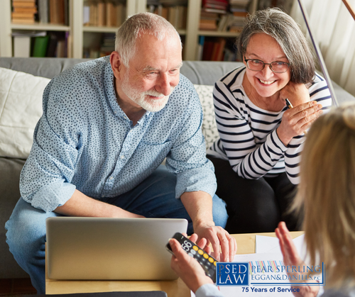 senior couple meeting with an estate planning attorney